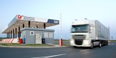 Truck driving past an IDS gas station