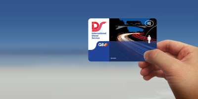 IDS fuel card in hand with faded background from white to blue