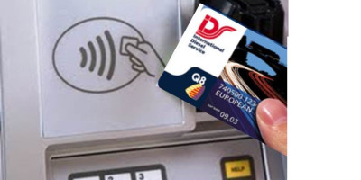 Person holding IDS fuel card against payment terminal